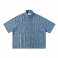 Blue distressed short-sleeve button-up shirt with pointed collar and chest pockets