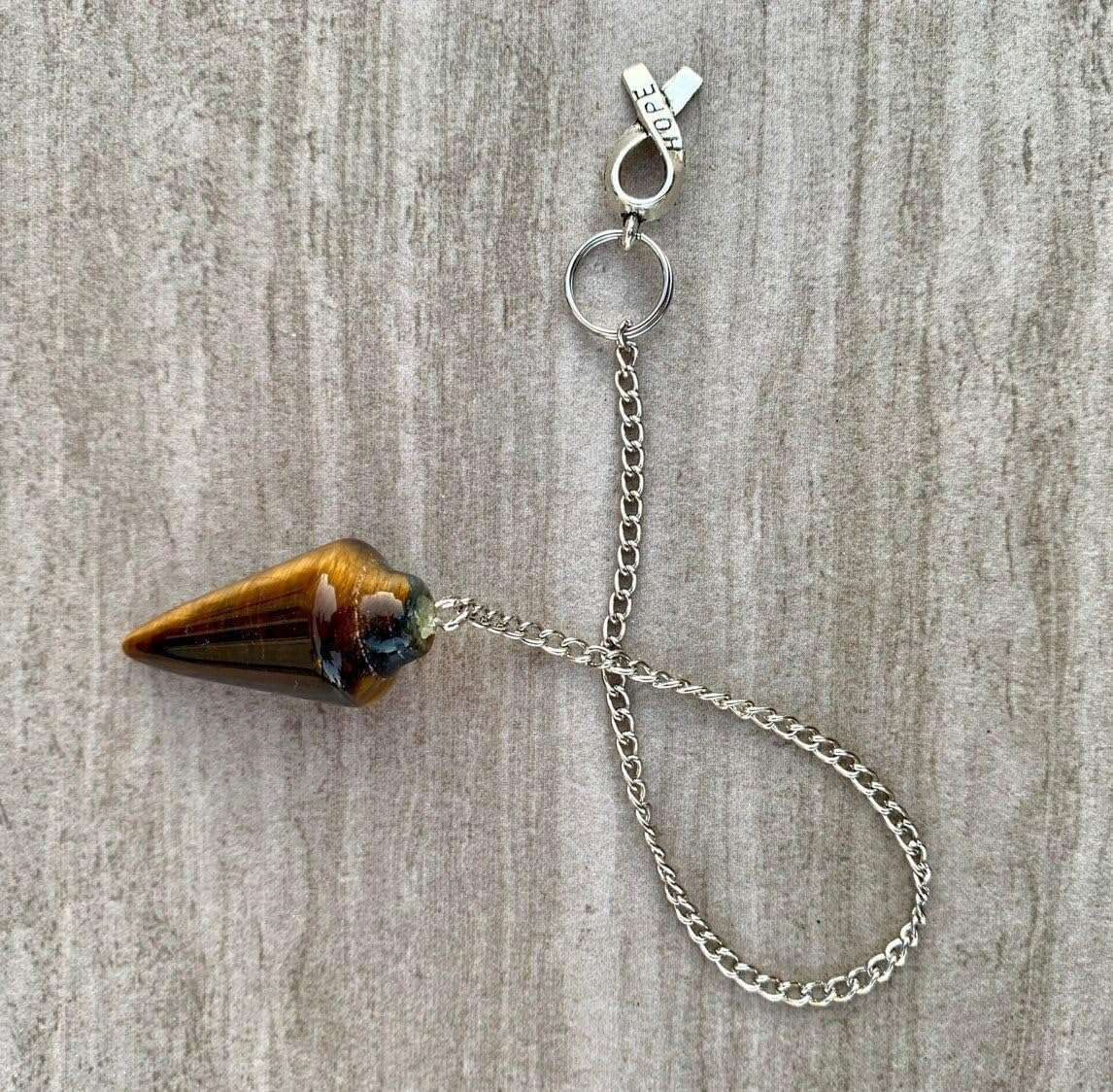 Tigers eye pendulum bag charm with silver chain and clasp, teardrop gemstone