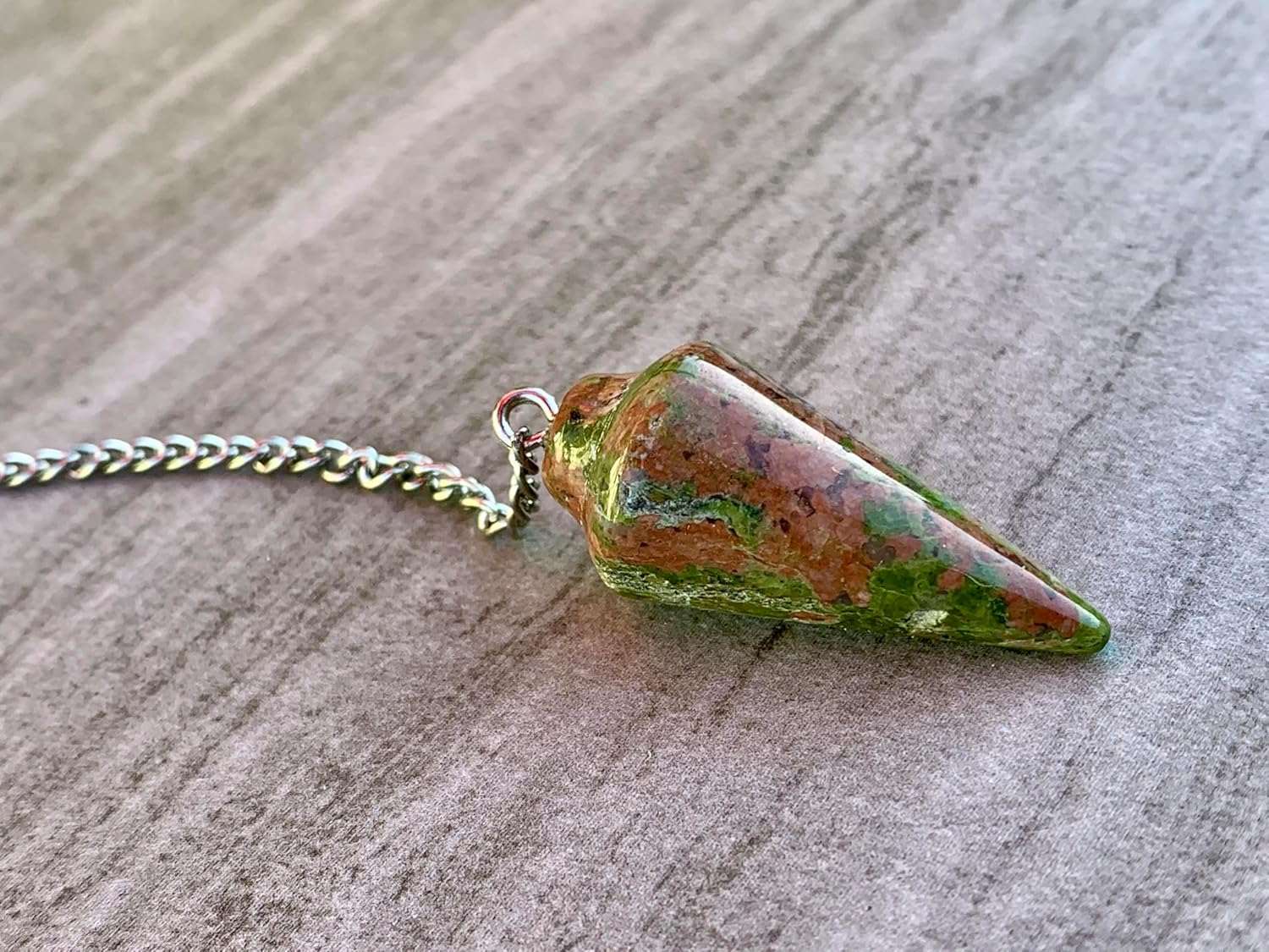 Unakite stone pendulum on silver-tone chain, green and red speckled