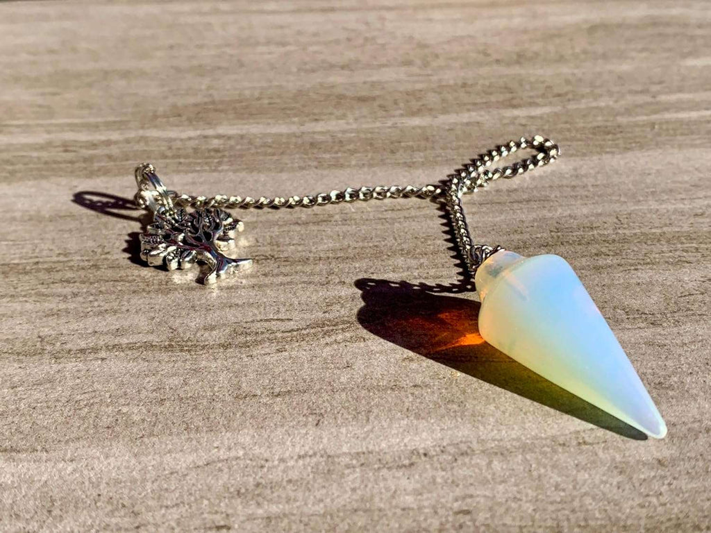 Opalite pendulum bag charm with tree charm and gold-tone chain, blue teardrop