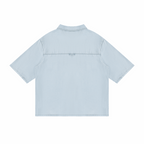 Unisex vintage wash drop-shoulder lyocell shirt, light blue, back view with yoke seam