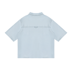 Light blue vintage-wash lyocell drop-shoulder button-up shirt, pointed collar, short sleeves.