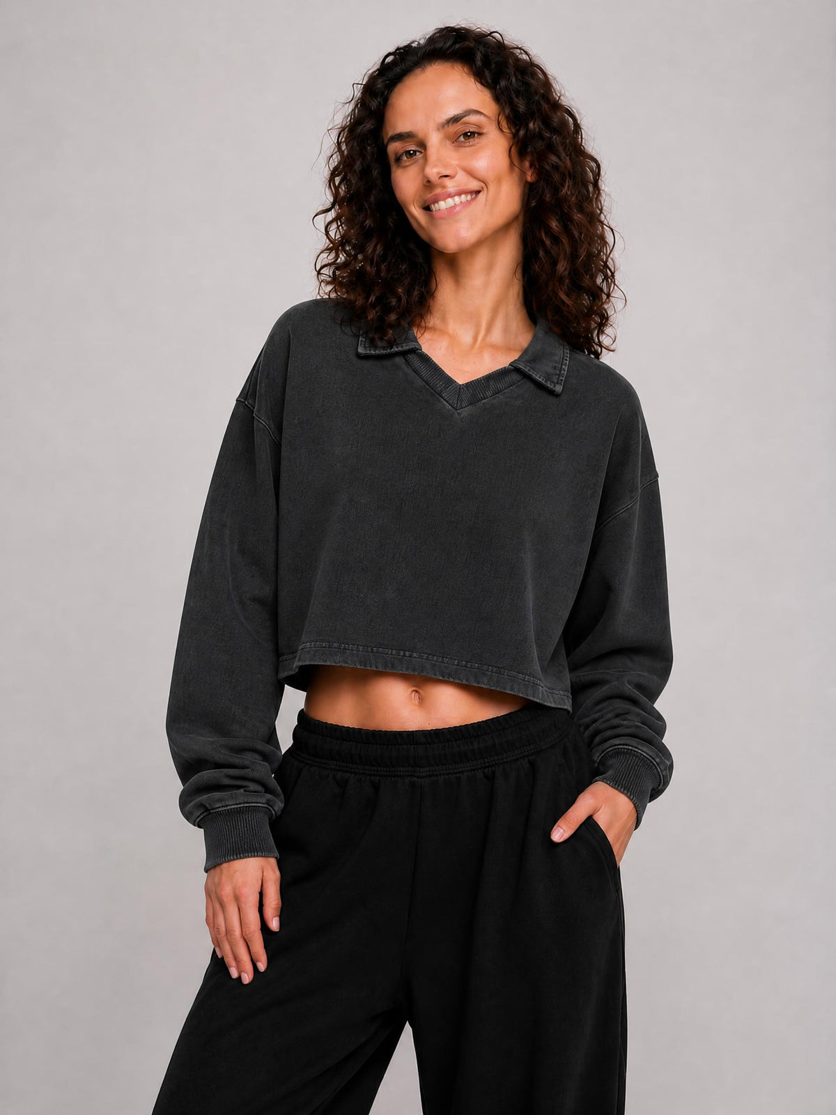 Dark gray cropped sweatshirt with V-neck and long sleeves, vintage wash