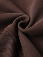 Cropped half-zip hoodie in dark brown knit with ribbed cuff detail