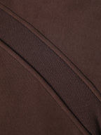 Cropped half-zip hoodie fabric texture in dark brown with ribbed knit panel