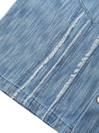 Distressed blue shirt hem with worn stripes and frayed detailing