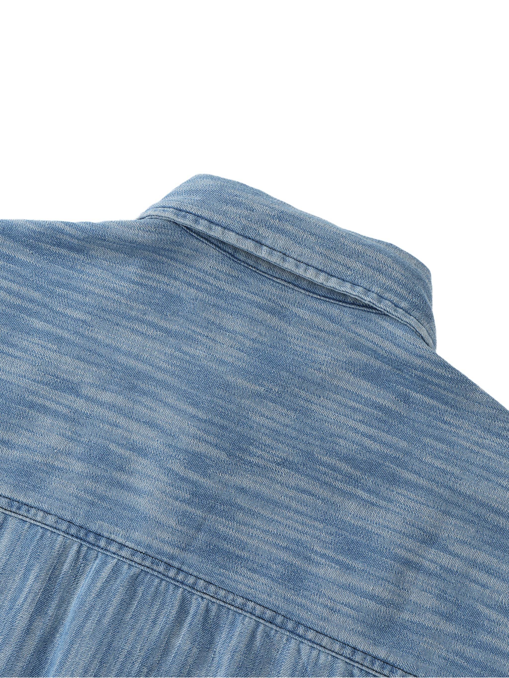 Blue distressed shirt shoulder and upper back yoke with textured wash finish