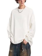 White oversized knit sweatshirt with round neck and long sleeves, loose drape