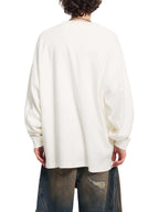 White oversized knit sweatshirt, back view with long sleeves and dropped shoulder fit