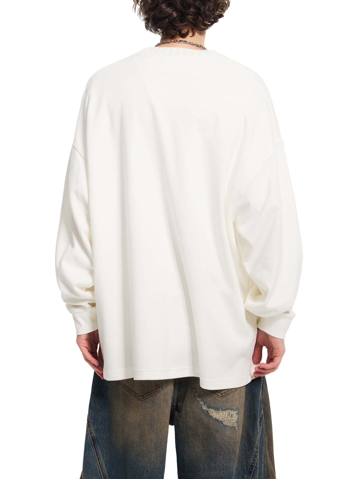 White oversized knit sweatshirt, back view with long sleeves and dropped shoulder fit