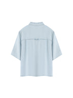 Light blue lyocell shirt with stand collar, short sleeves, back yoke seam.