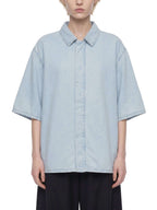 Light blue vintage-wash lyocell button-up shirt with drop shoulders and short sleeves