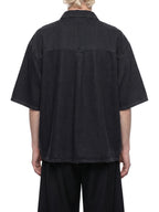 Black lyocell drop-shoulder button-up shirt, back view, short sleeves.