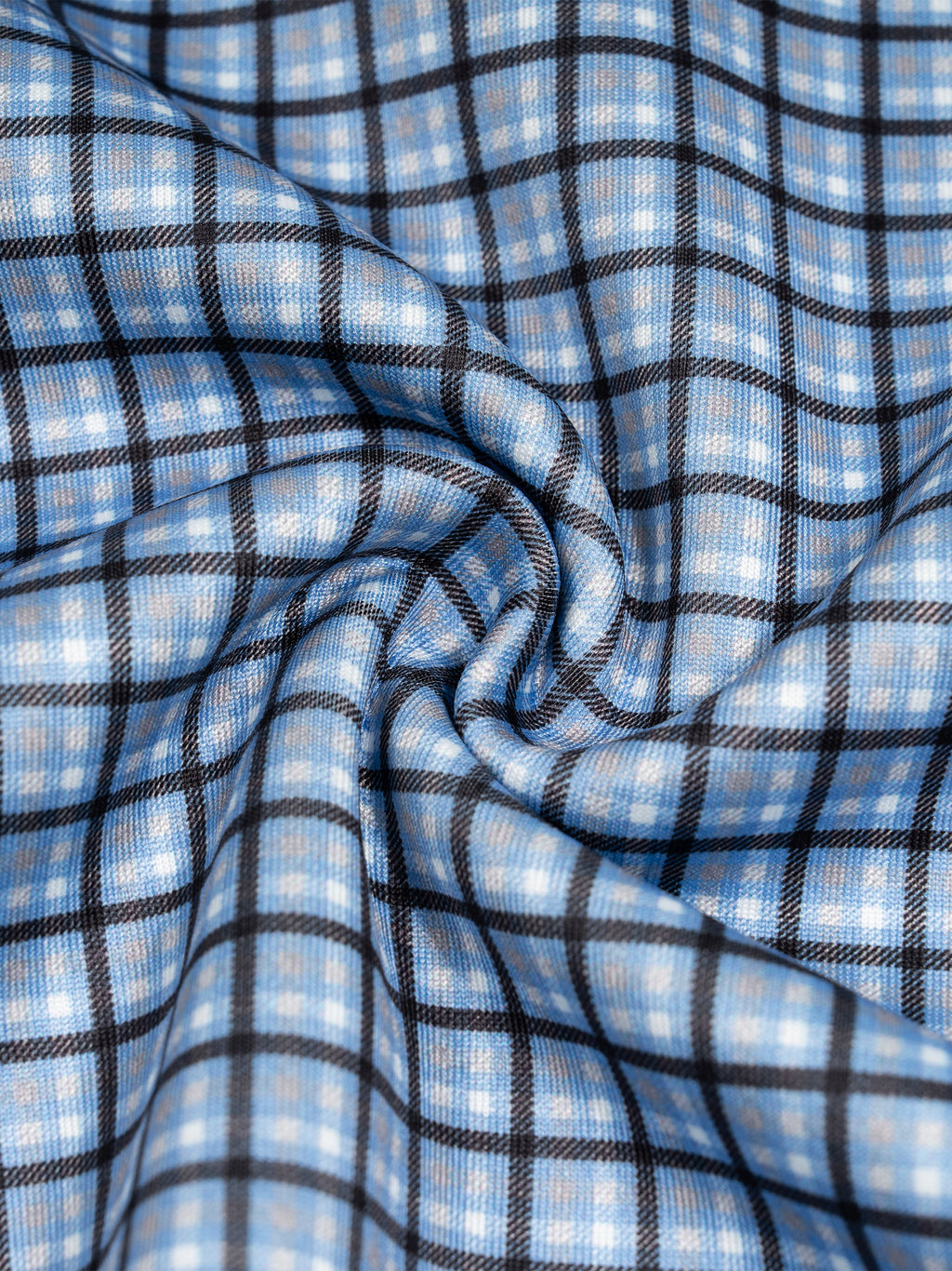 Sky blue plaid sweatshirt fabric close-up with stitched seams