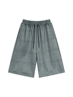 Navy blue plaid drawstring shorts, front view with vertical drawcord detail