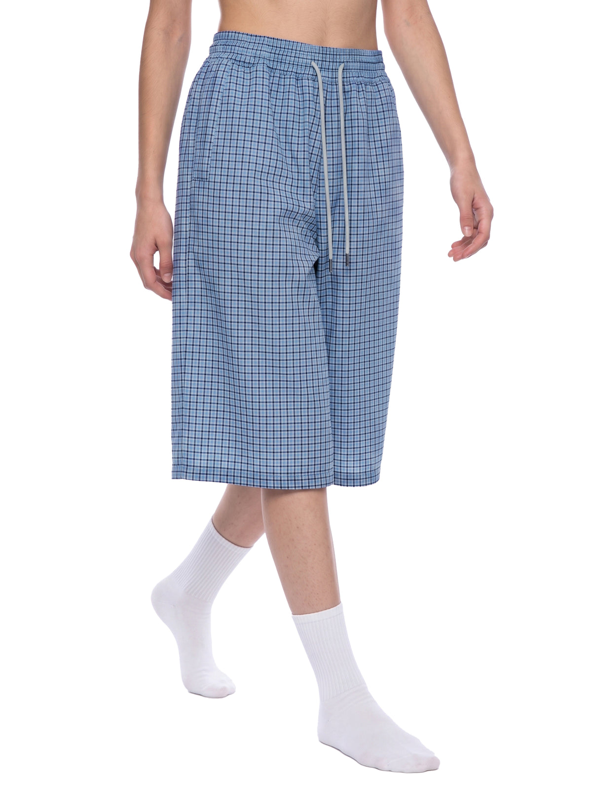 Blue plaid drawstring shorts with elastic waistband and long drawstrings