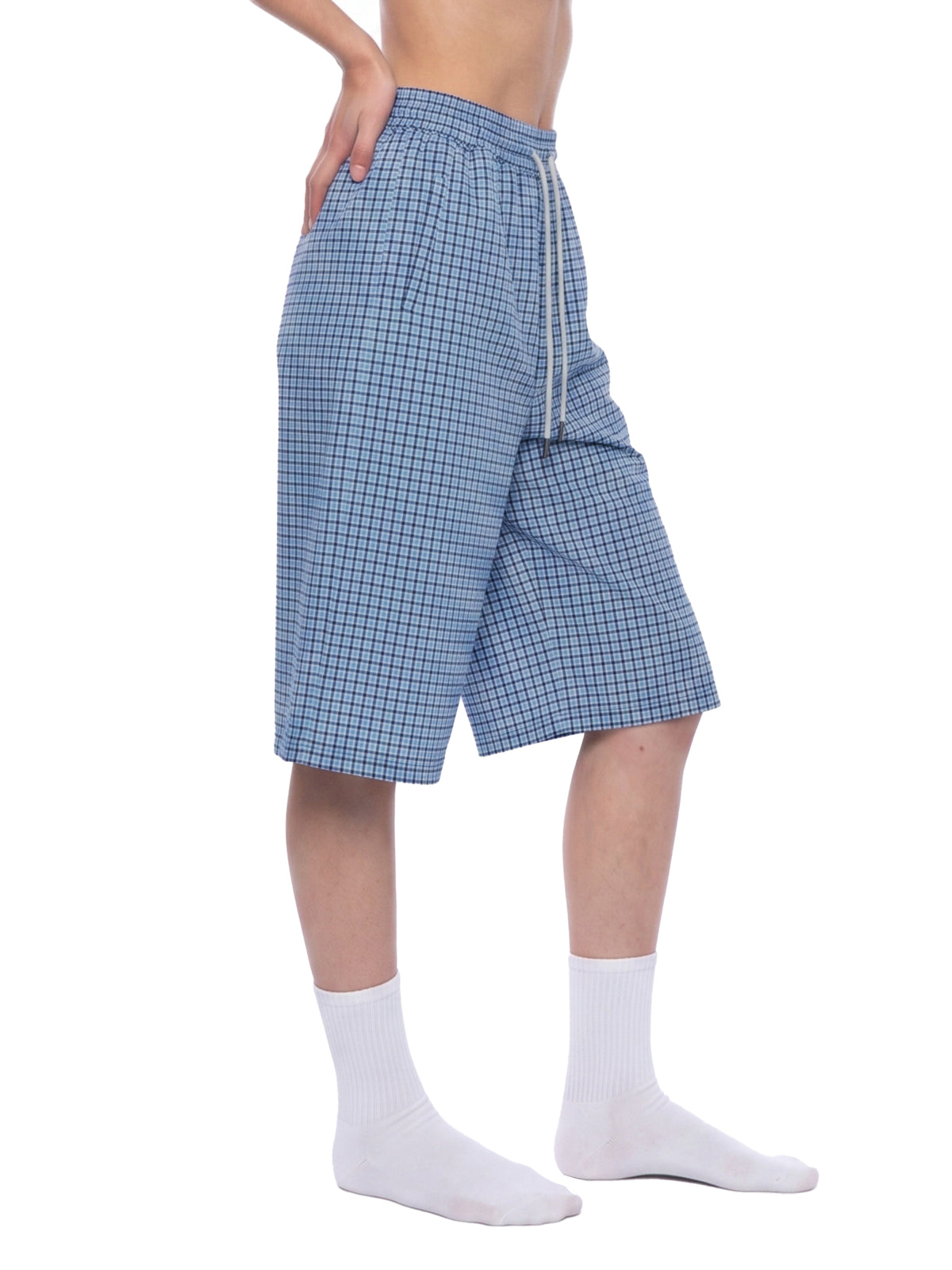 Blue plaid drawstring shorts, angled side view with elastic waistband