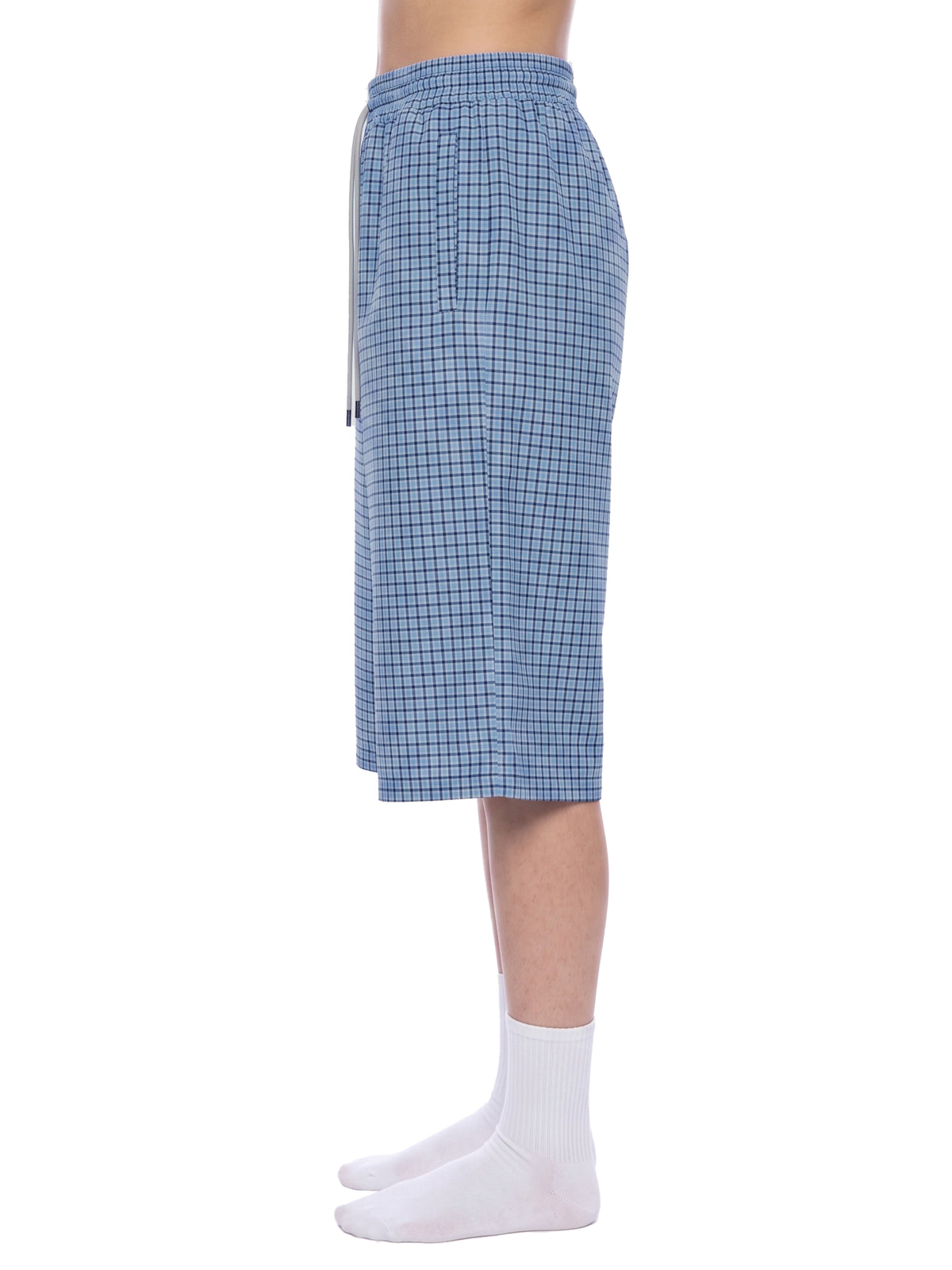 Blue plaid drawstring shorts, back view with elastic waistband