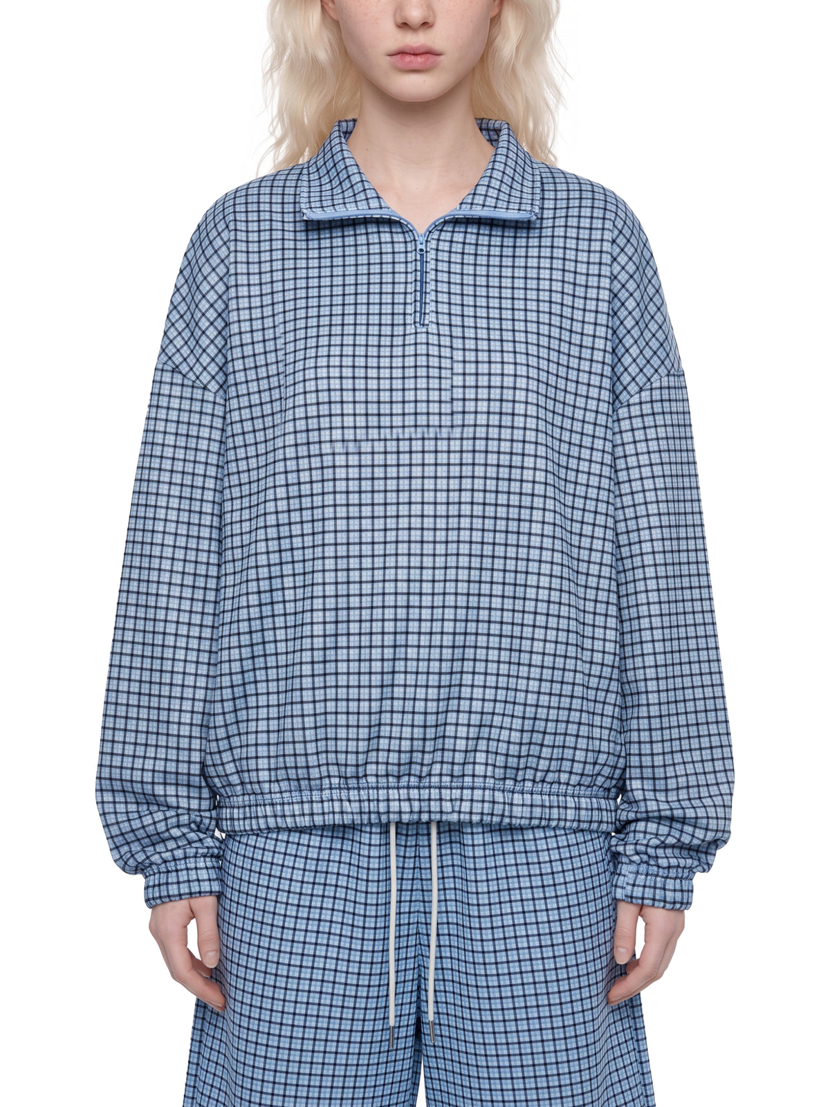 Sky blue plaid quarter-zip sweatshirt with collared zipper and elastic waist hem