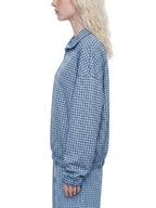 Sky blue plaid quarter-zip sweatshirt side view with long sleeves and ribbed cuffs