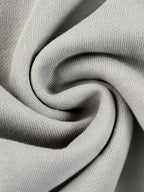 Light gray hoodie knit fabric close-up with soft heather texture