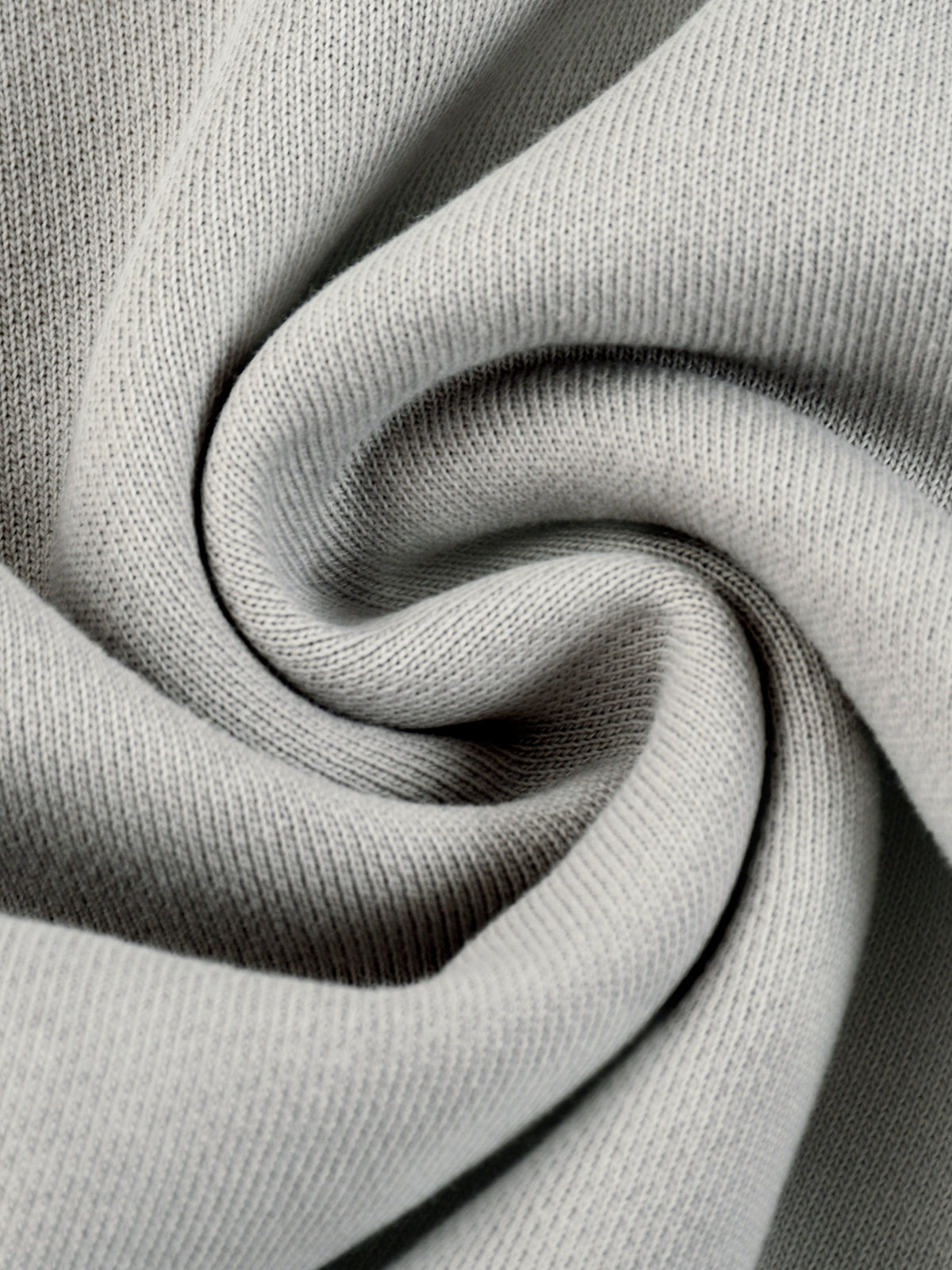 Light gray hoodie knit fabric close-up with soft heather texture