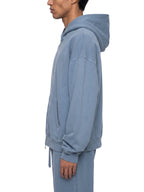 Jeans blue full-zip boxy hoodie with hood, kangaroo pocket, and ribbed cuffs (side view)