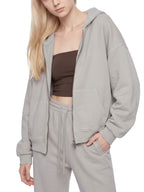 Light gray full-zip boxy hoodie with hood and front zipper (angled view)