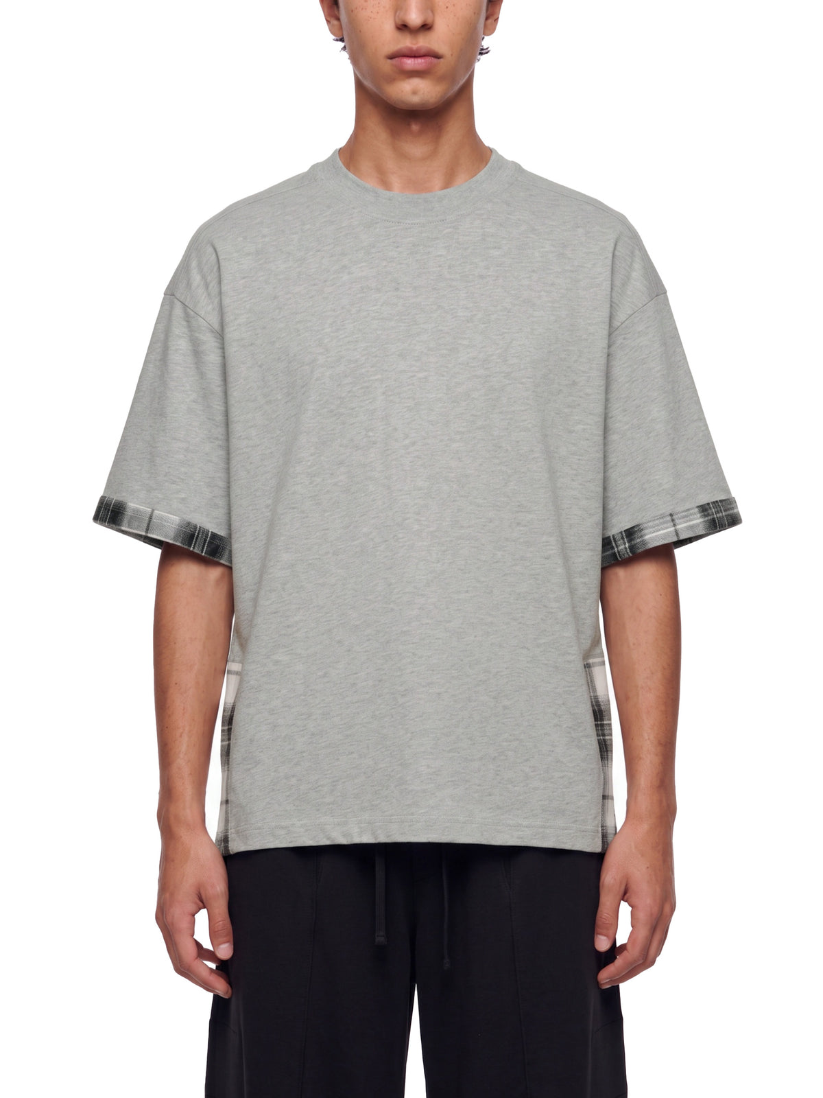 Gray unisex T-shirt on model, plaid paneled sleeves and side hem panels