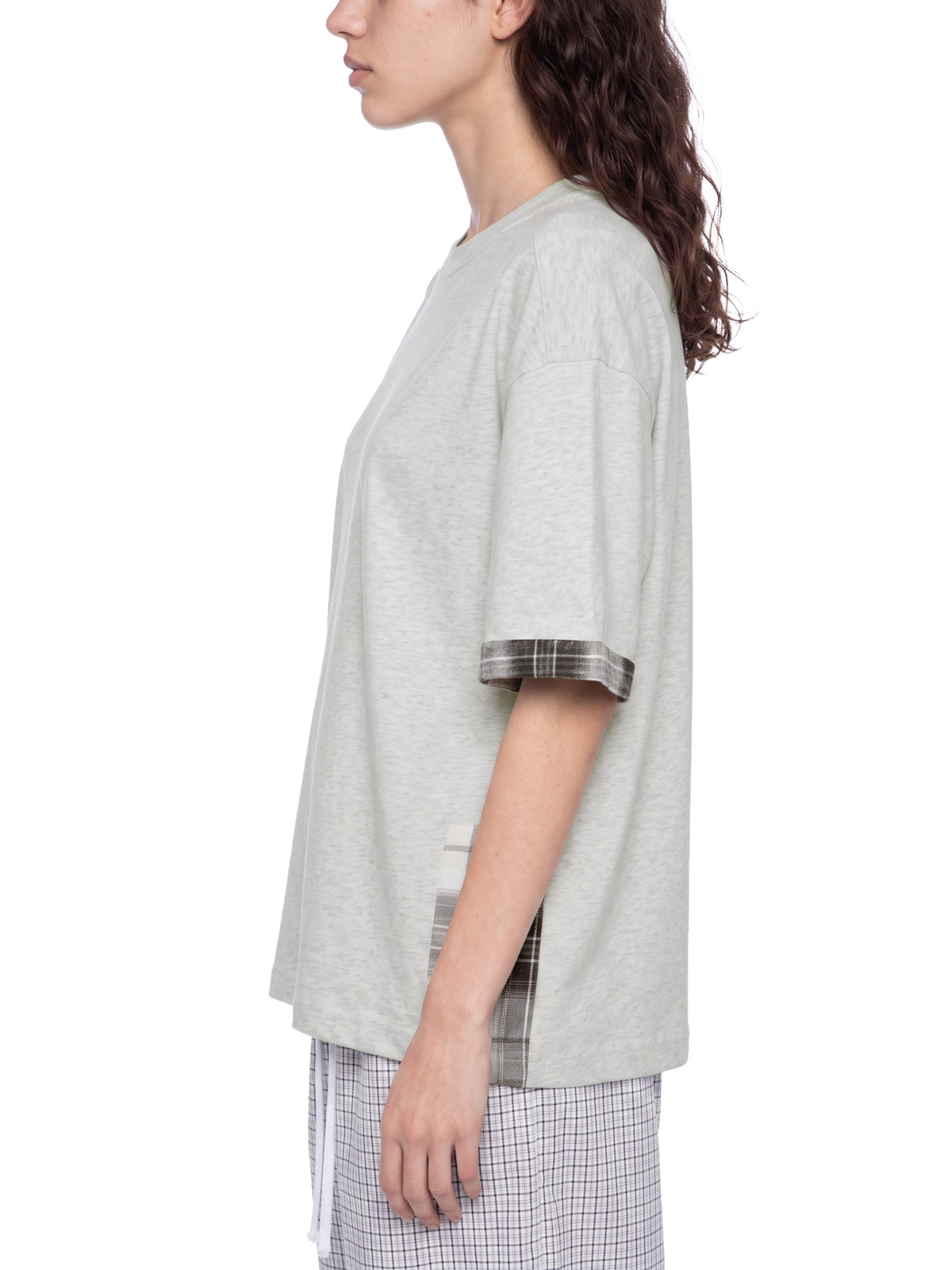 Unisex light gray T-shirt, side view, featuring plaid-trim short sleeve cuffs