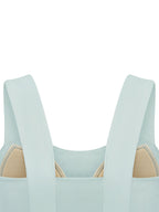 Mint green yoga crop tank top close-up: wide straps with square neckline front.