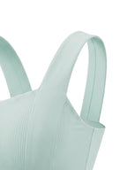 Mint green tank top close-up of wide strap and ribbed front knit texture.