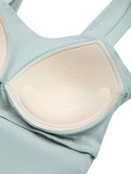 Mint green yoga crop tank top with scoop neckline and contrast cream trim detail