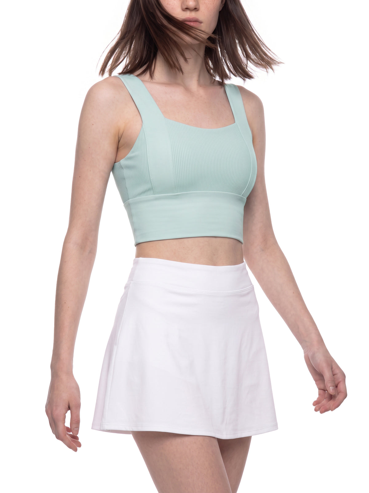 Mint green yoga crop tank top with wide straps, square neckline, and cropped length.