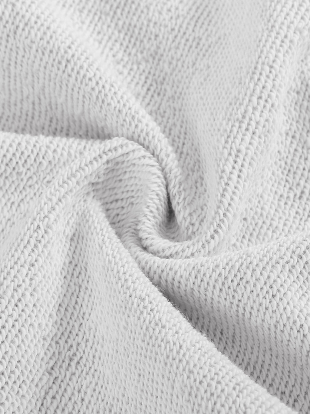 Light gray sweatshirt knit fabric close-up showing waffle texture