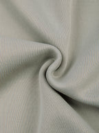Oat gray knit fabric close-up with smooth texture and heather weave