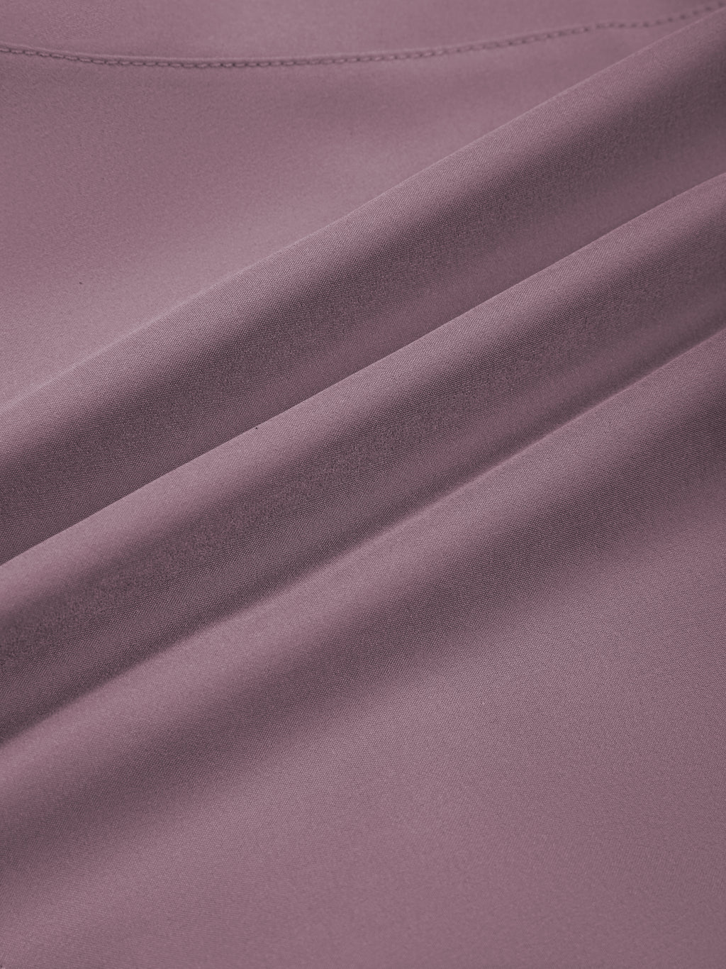 Women’s paneled yoga shorts, purple fabric close-up