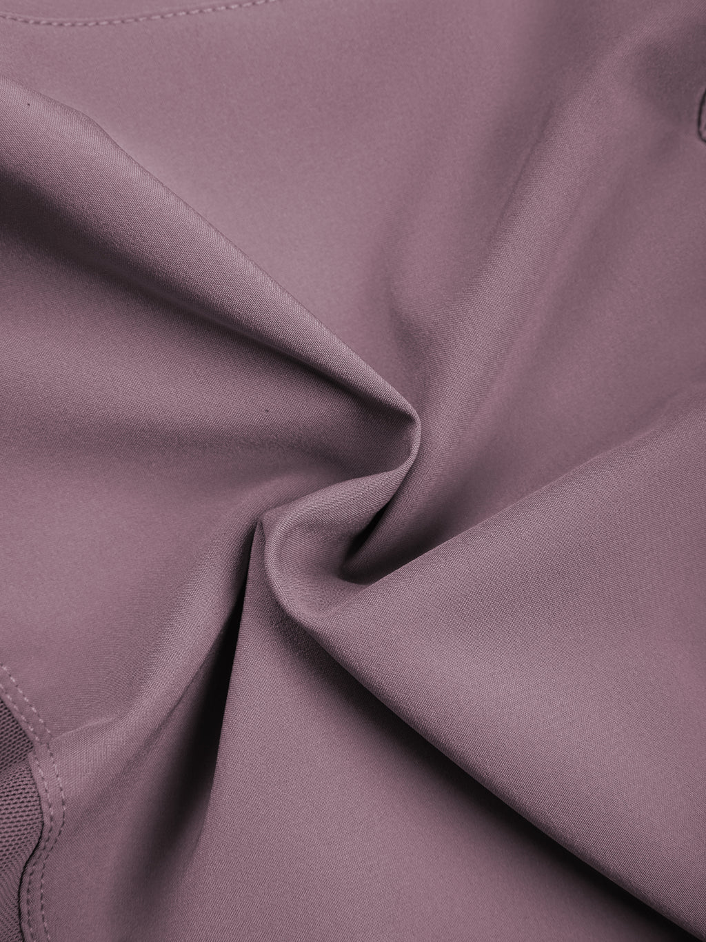 Women’s purple yoga shorts fabric close-up with smooth stretch texture