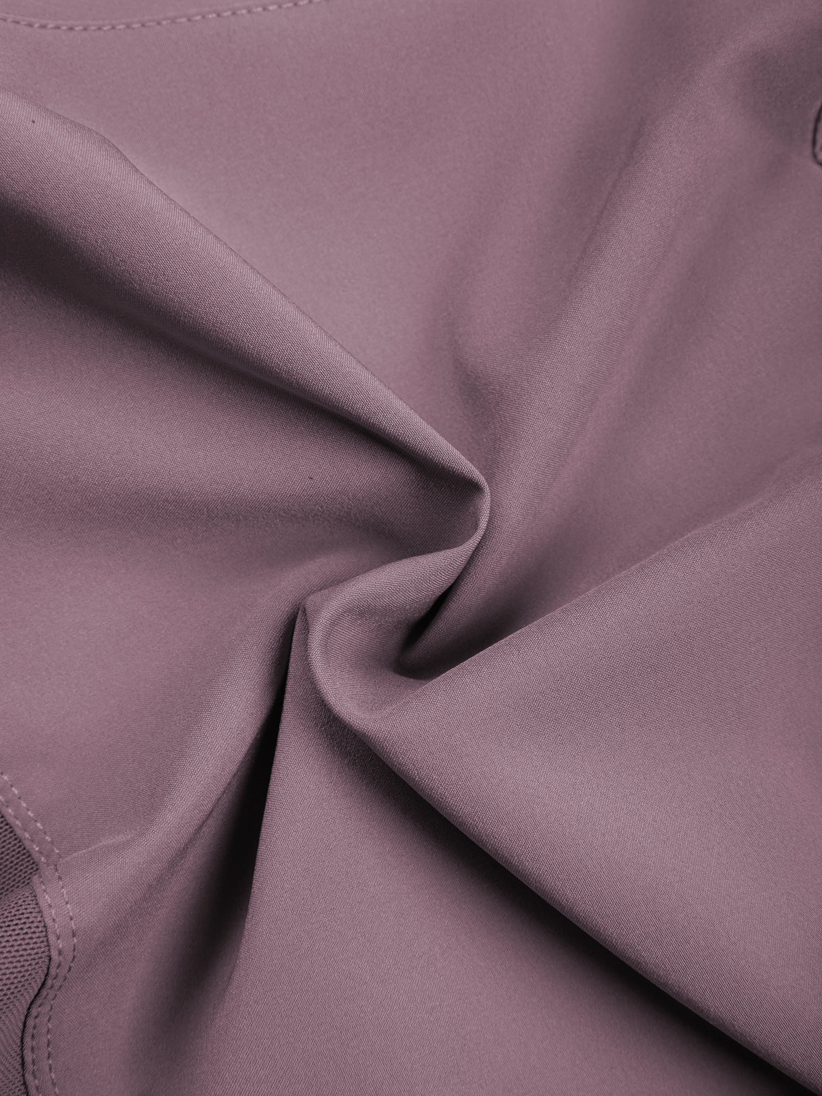 Women’s purple yoga shorts fabric close-up with smooth stretch texture