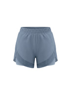 Light blue paneled yoga shorts with wide elastic waistband and relaxed fit.