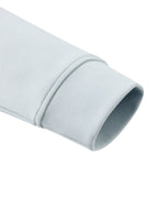 Light blue jacket sleeve cuff with clean stitched hem