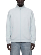 Pale blue stand collar zip jacket worn over jeans, front view with two side pockets.