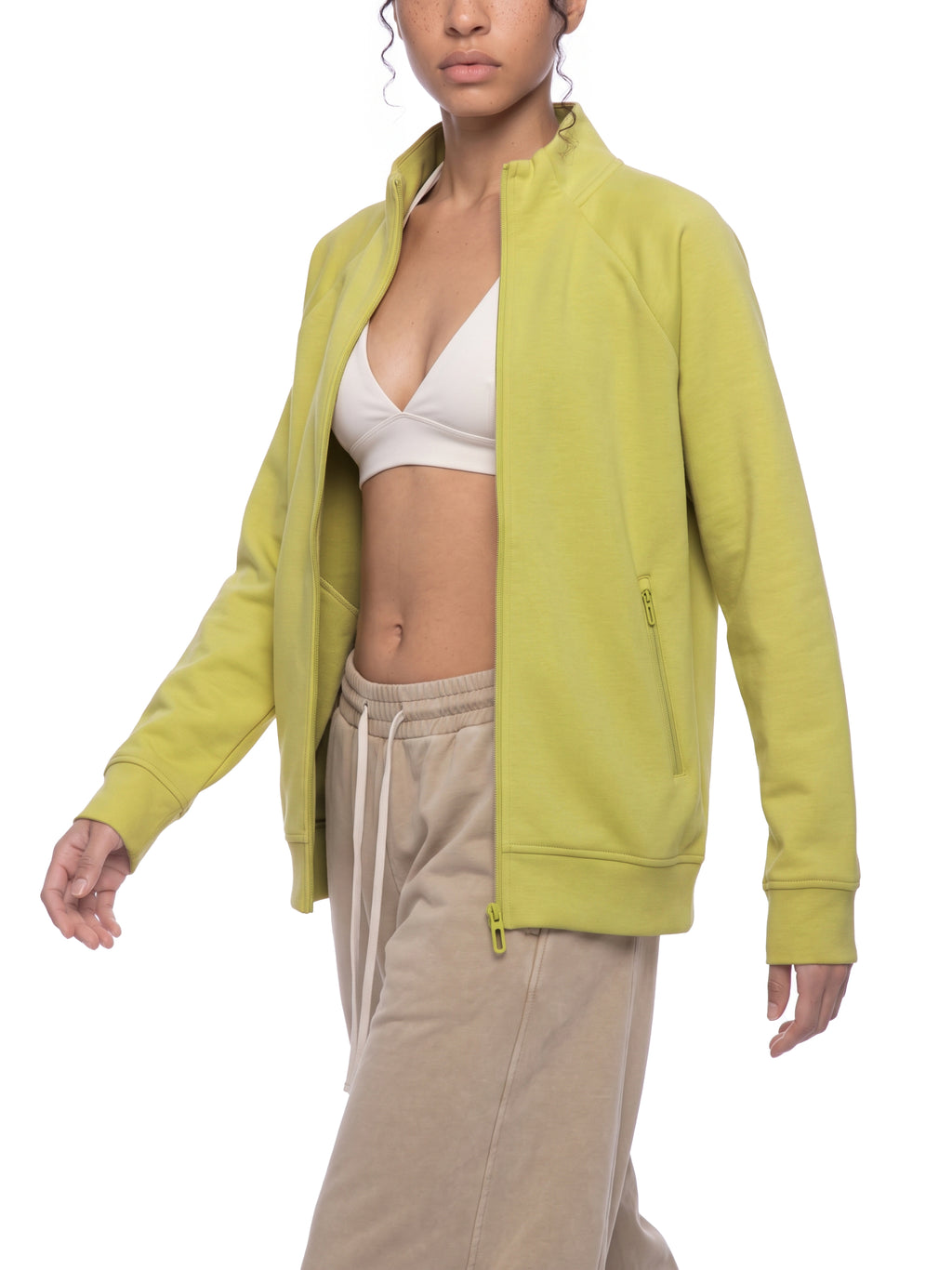 Lime yellow stand collar zip jacket worn open, front view with long sleeves.
