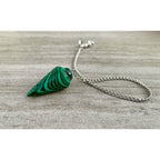 Malachite pendulum with green striped stone and silver chain, loop bail visible