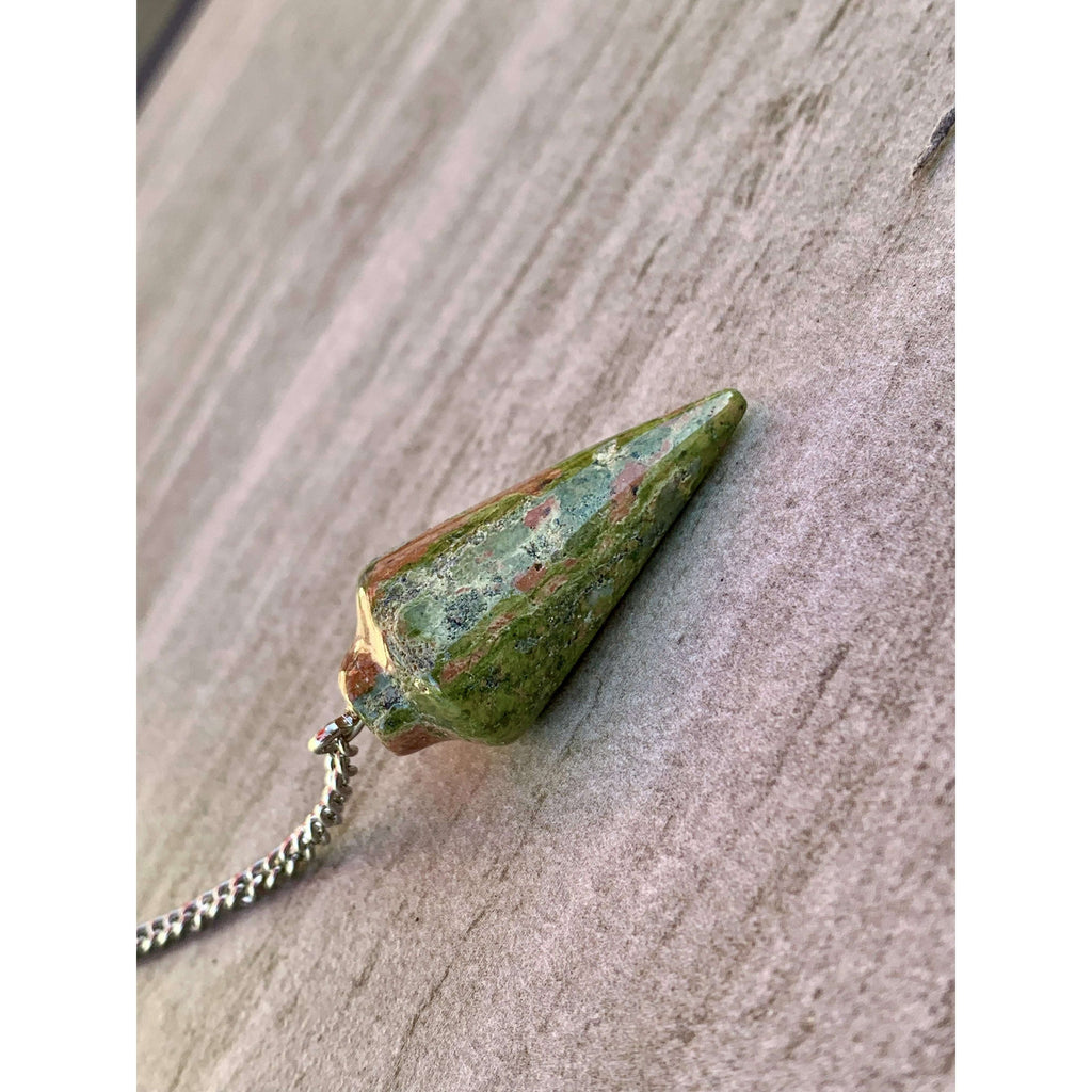 Unakite dowsing pendulum with green-red faceted cone stone and silver chain.