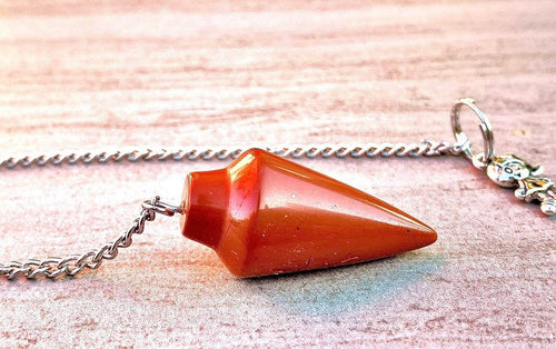 Red jasper pendulum bag charm on silver chain with small dangling charm