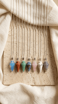 Pendulum gemstone necklace set with multiple colored teardrop pendants on silver chains