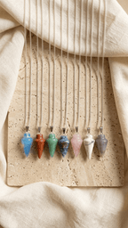 Pendulum gemstone necklace set with multiple colored teardrop pendants on silver chains