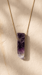 18k gold necklace with purple amethyst bar pendant on a thin chain
