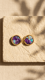 Gold opal stud earrings with purple gemstone center and iridescent bezel